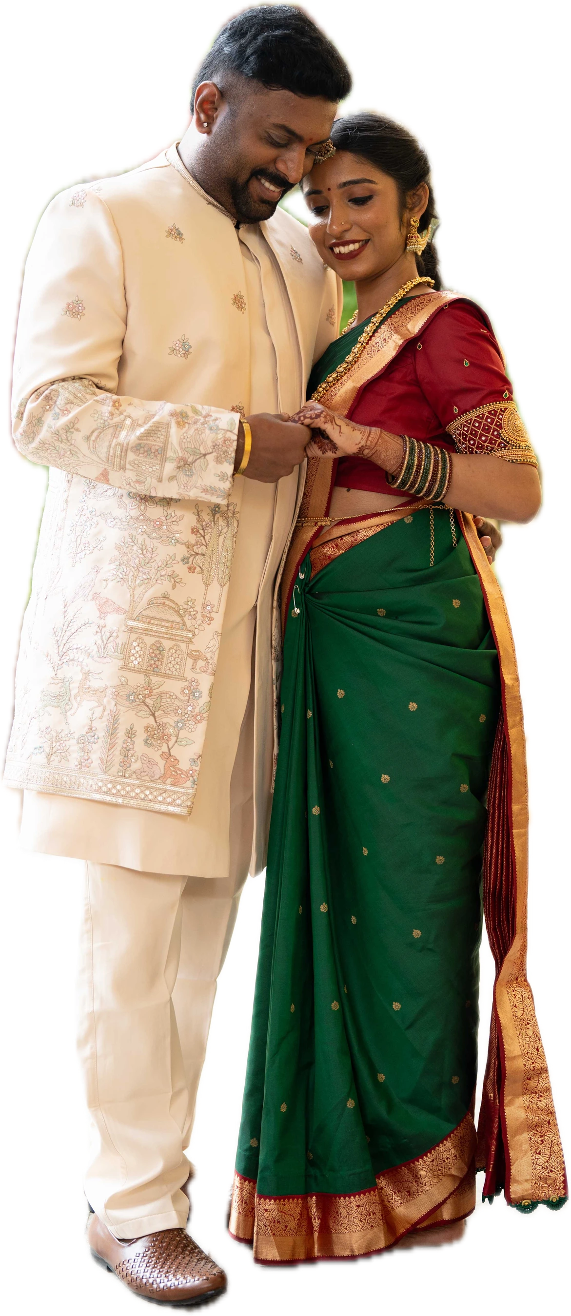 Prajwal and Triveni together in their wedding attire before the temple